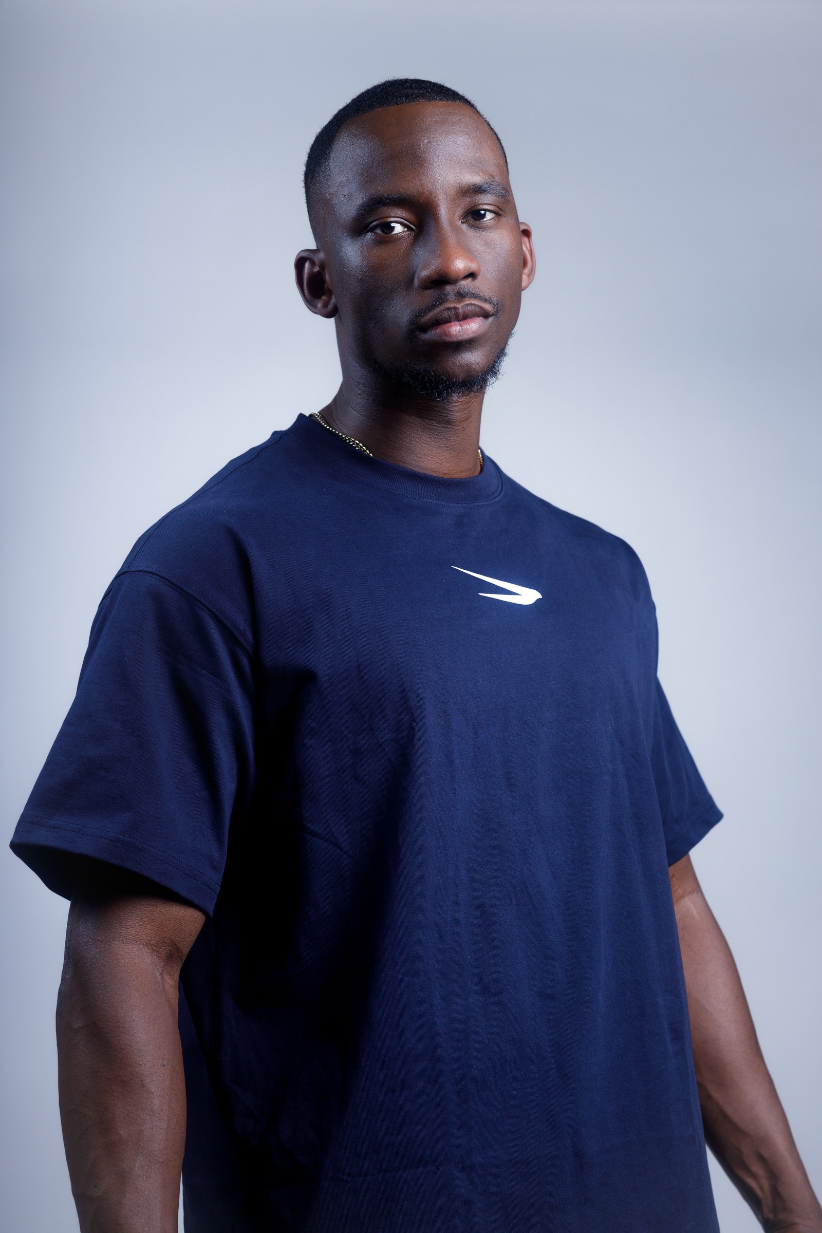 Studio portrait of an athlete in navy performance wear