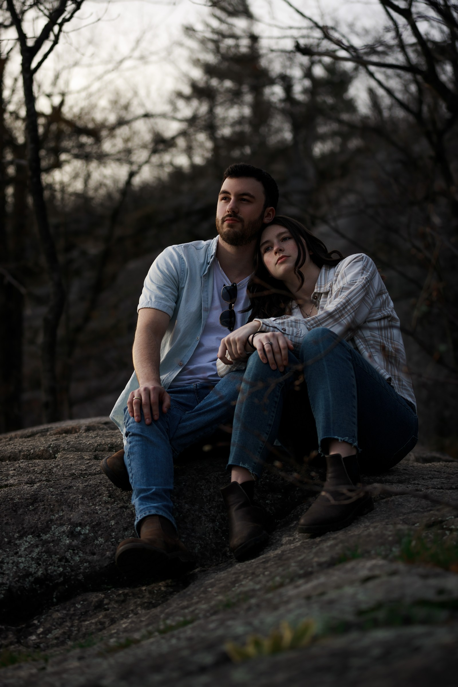 Relaxed couple leaning together during an outdoor session