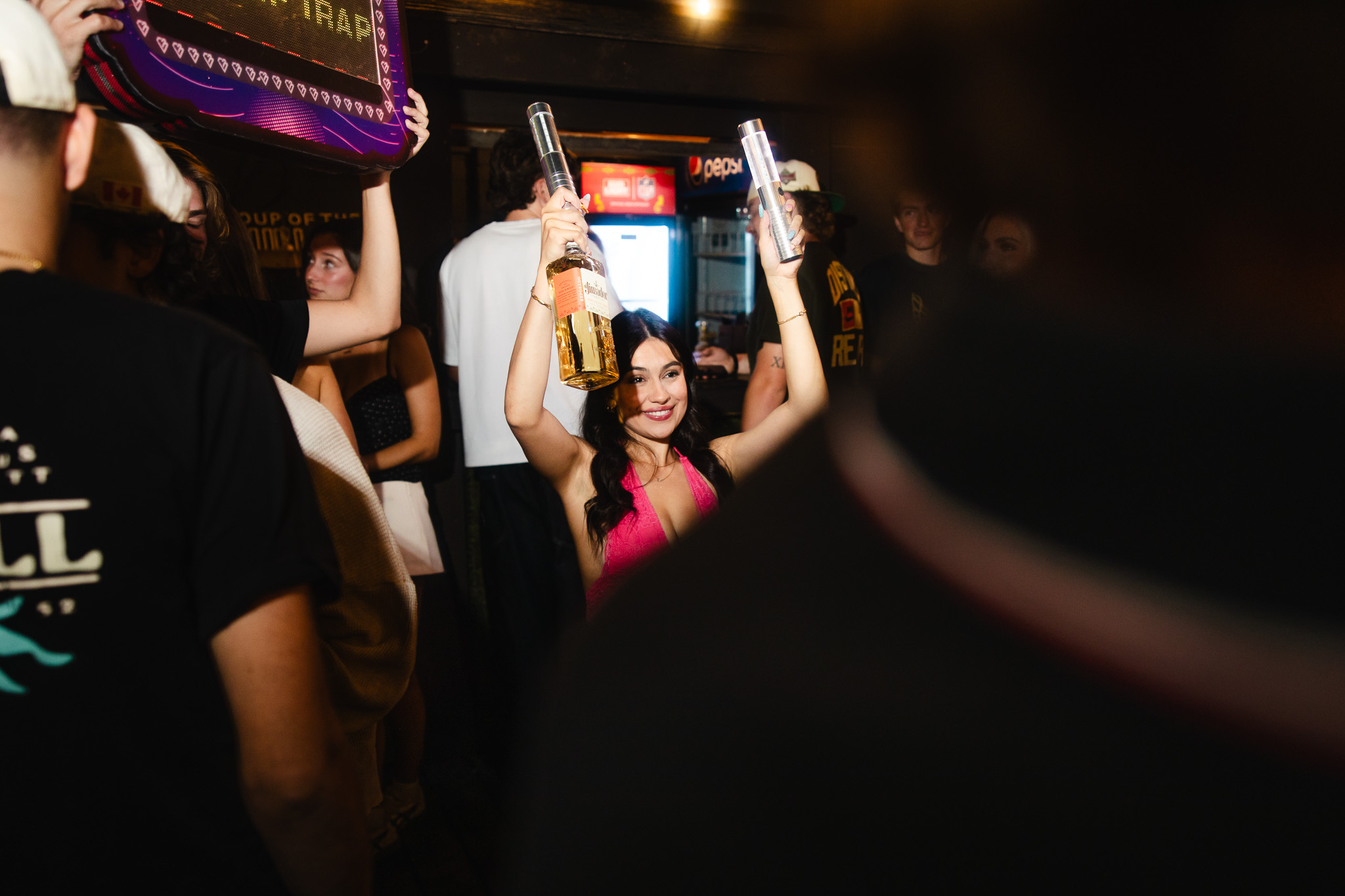 Bottle-service presentation moving through a busy club