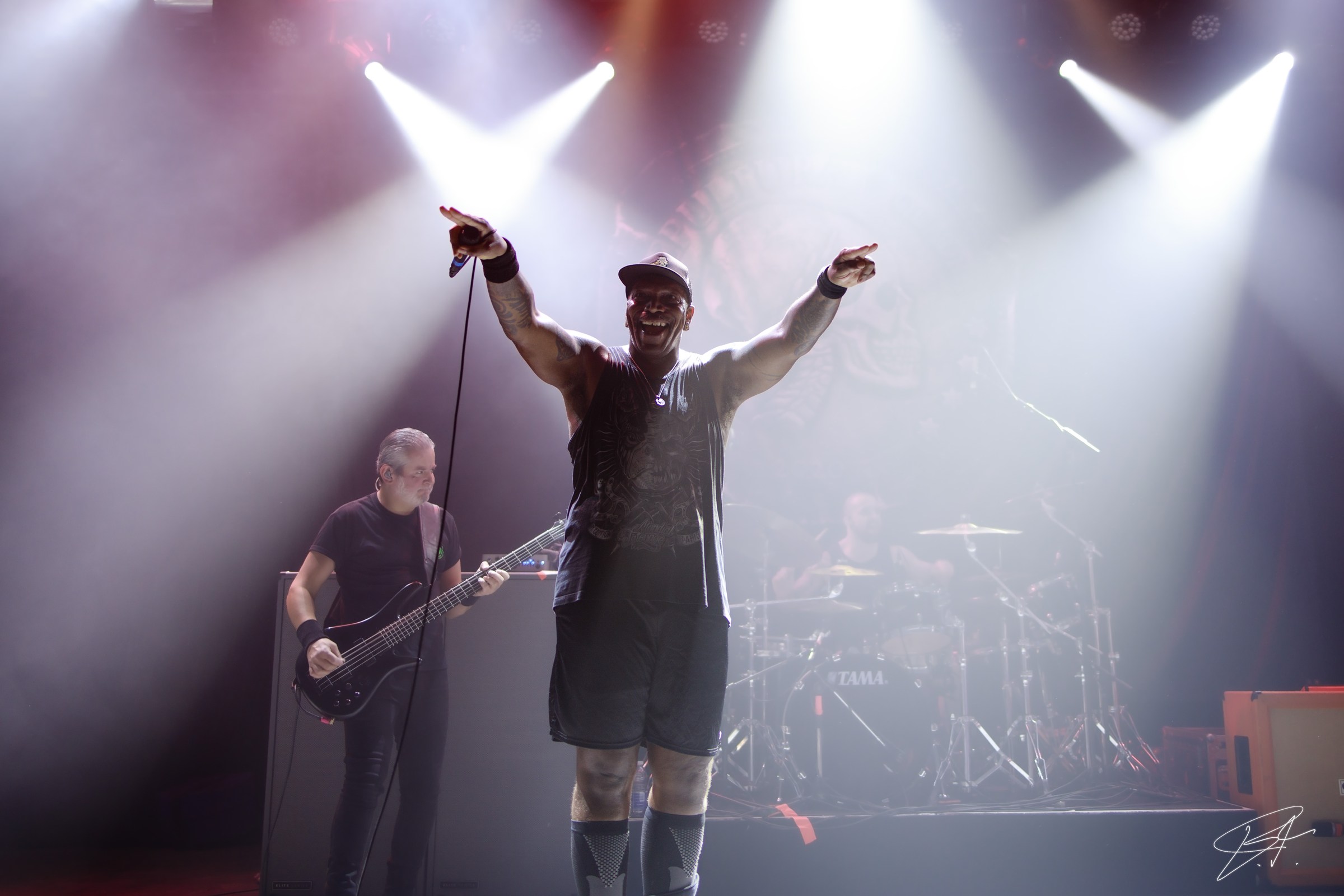 Lead vocalist commanding the stage during a live set