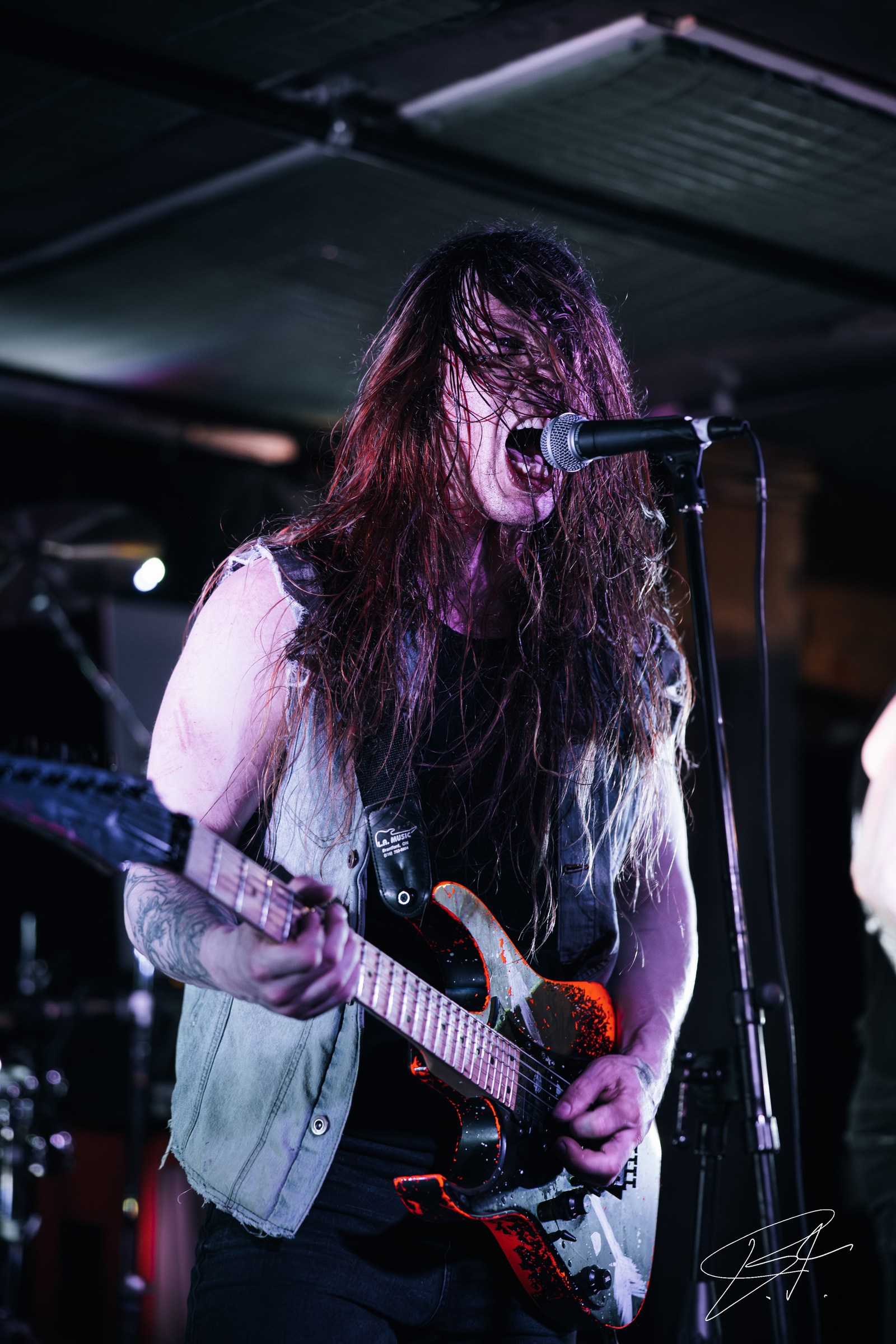 Drummer in motion during an intense concert set
