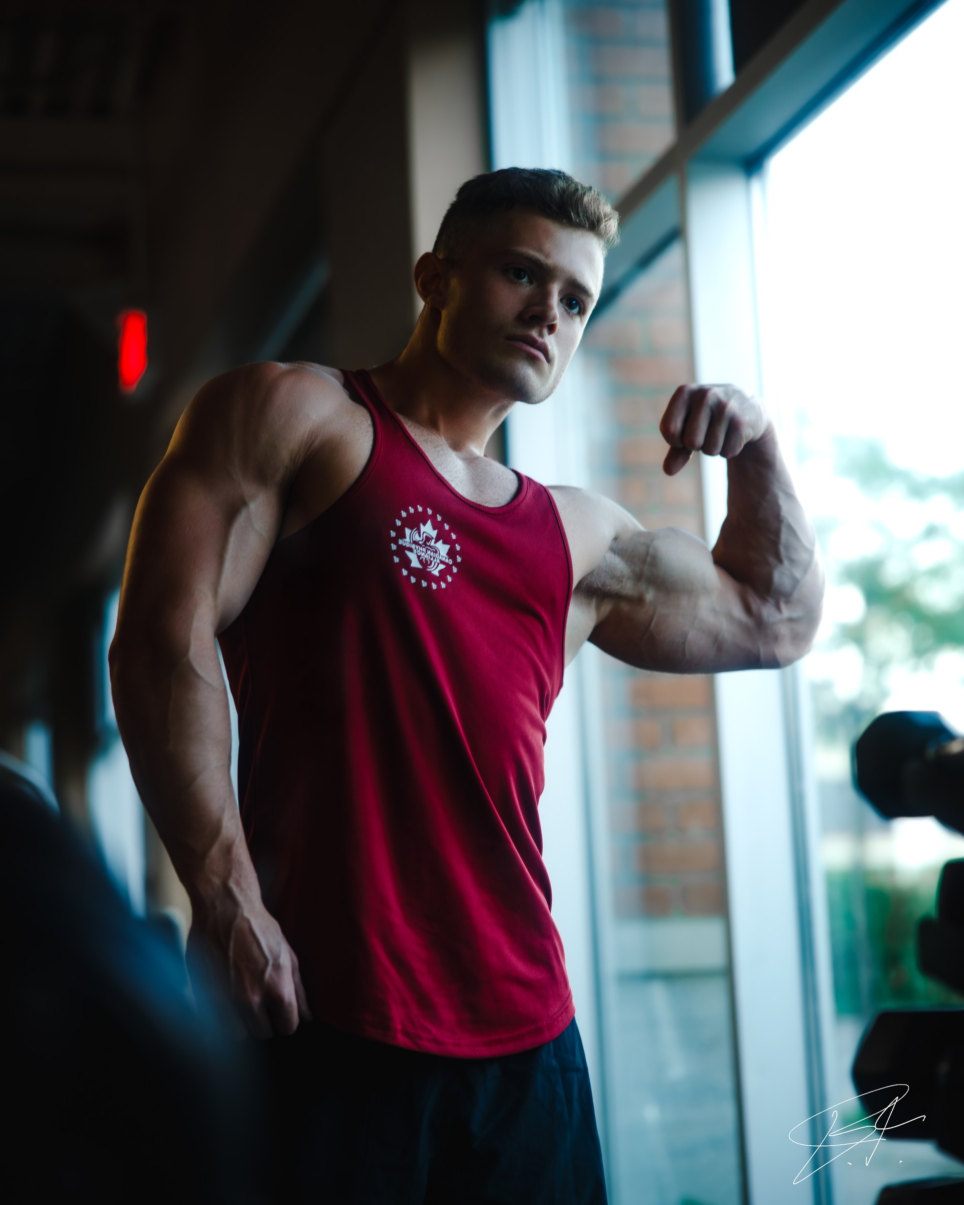 Athletic portrait of Alex beside a cool window light