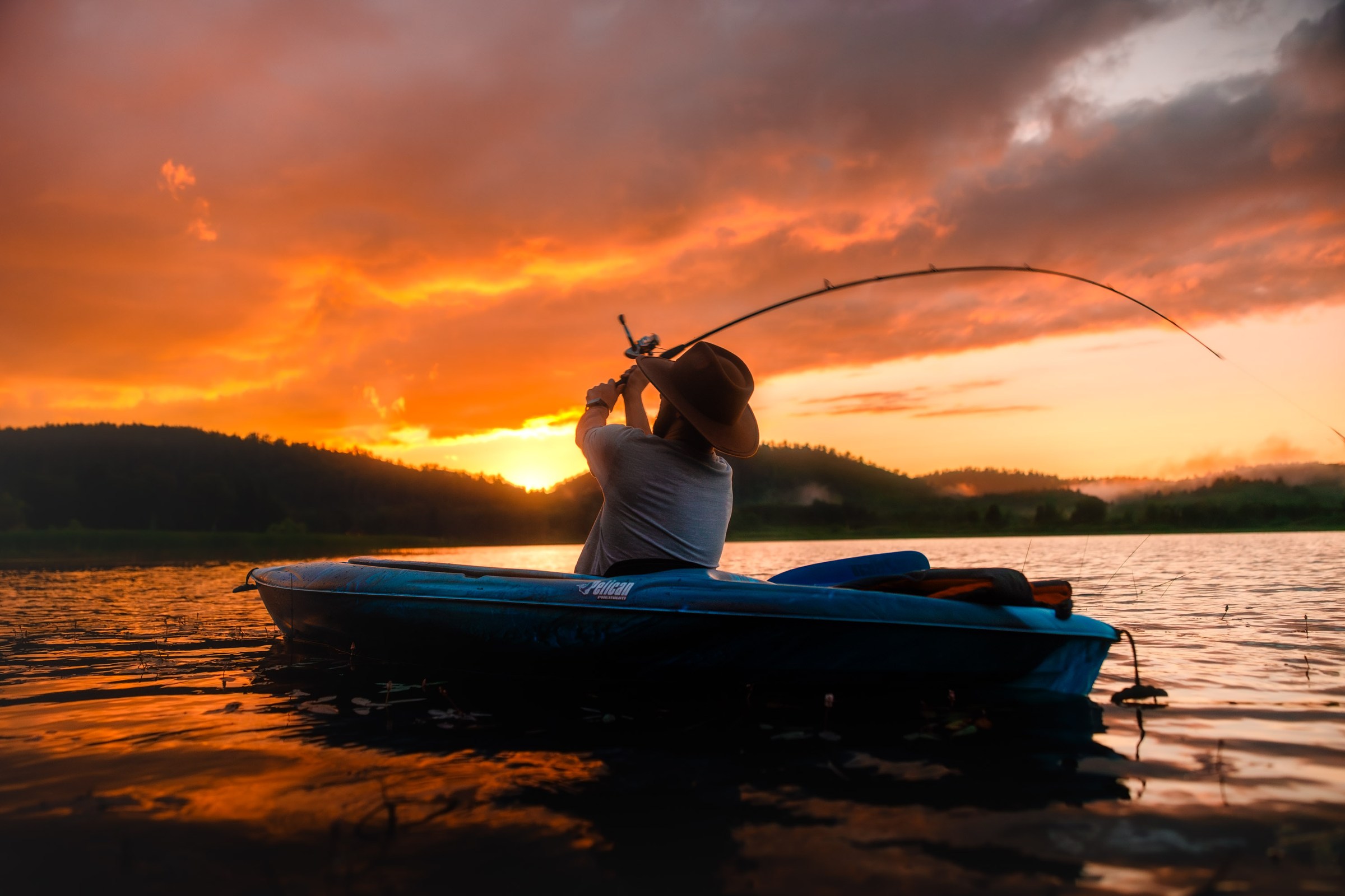 Silhouetted lifestyle portrait beside the water
