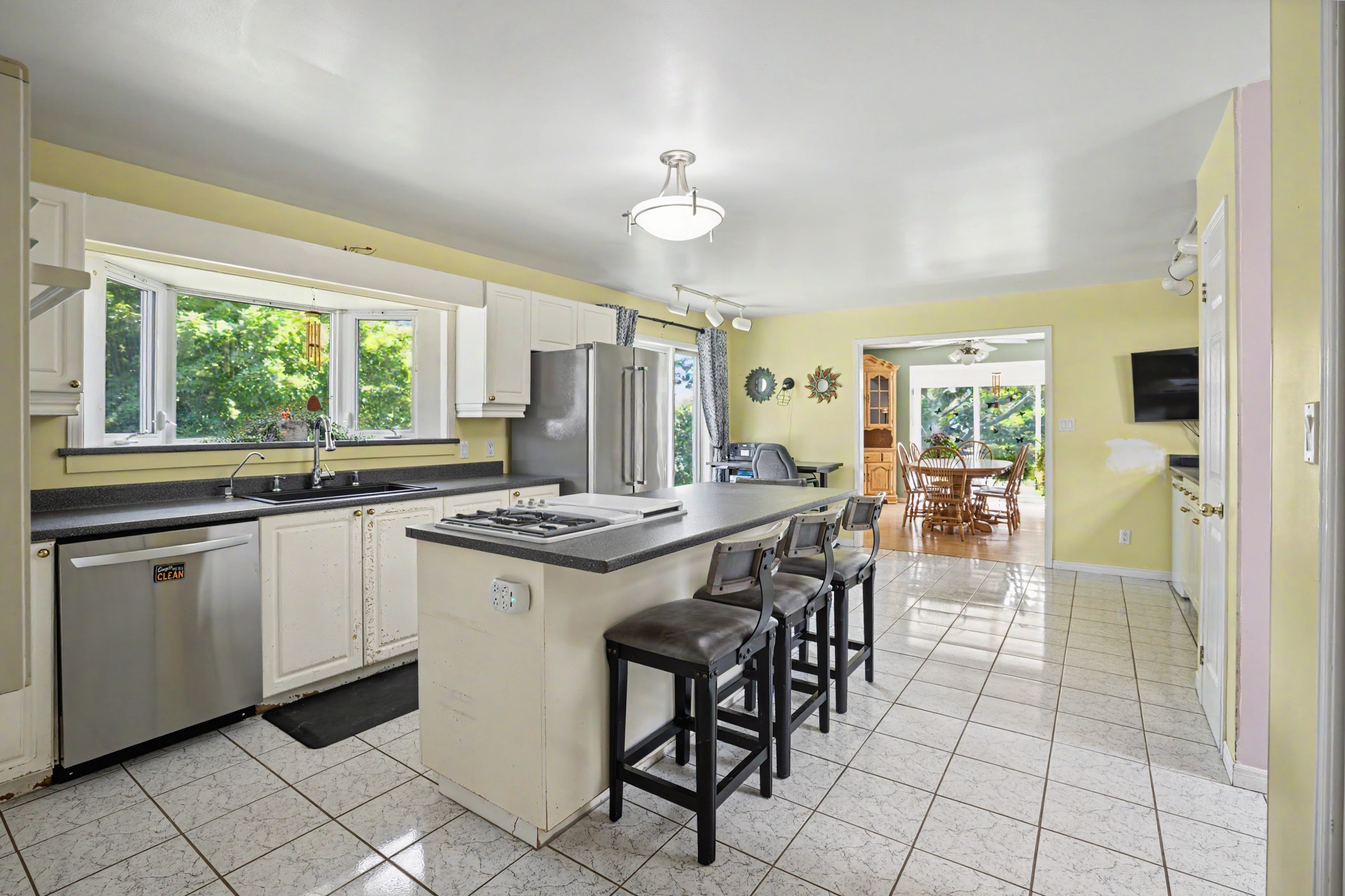 Spacious kitchen with island and stainless-steel appliances