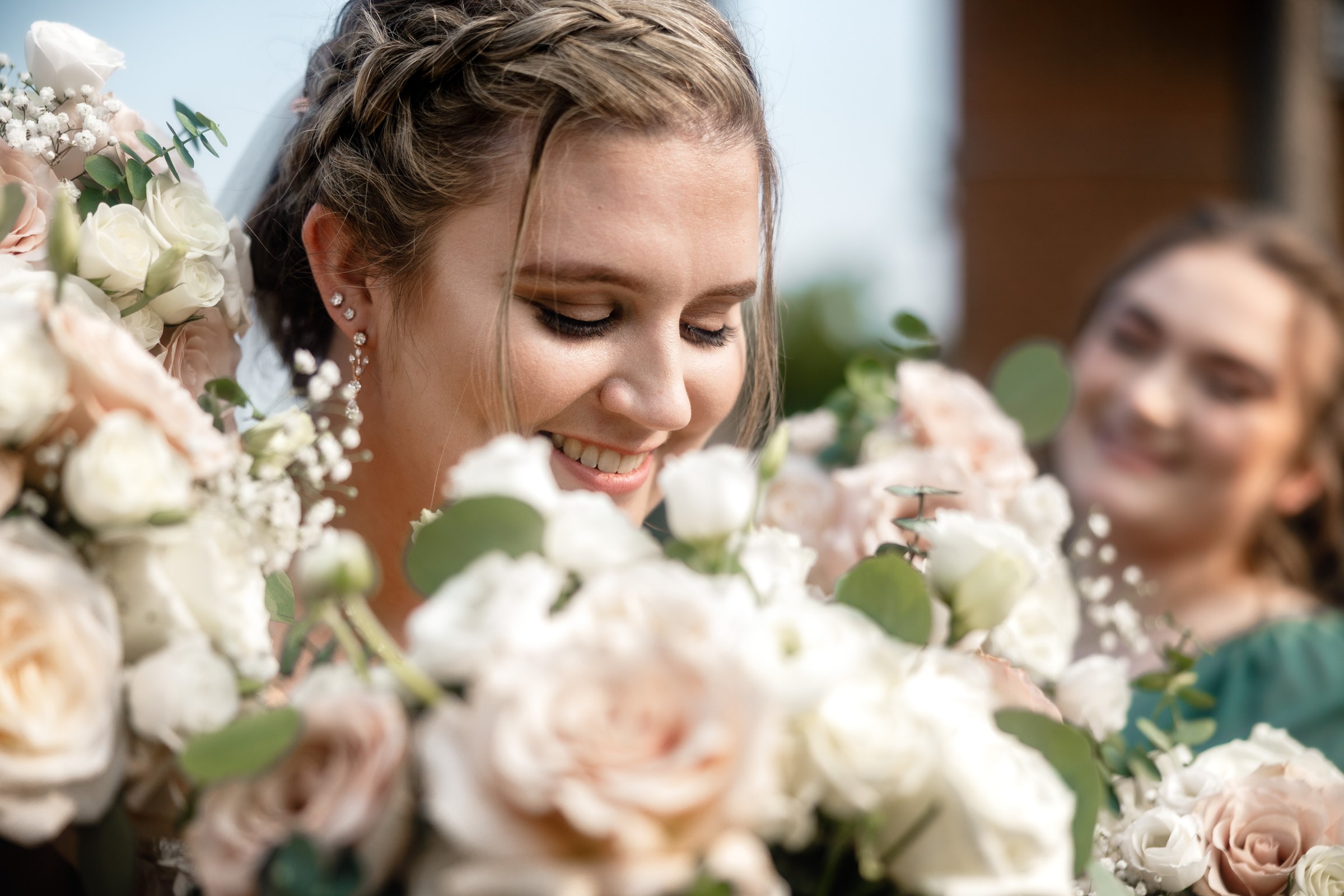 Newlyweds smiling together in an elevated outdoor portrait