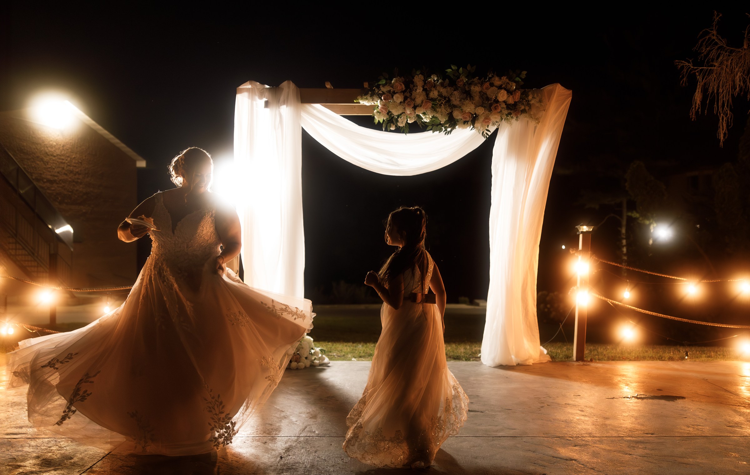 Wedding dance beneath warm reception lights